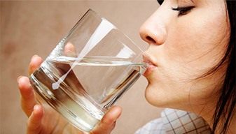 Lady drinking a glass of water