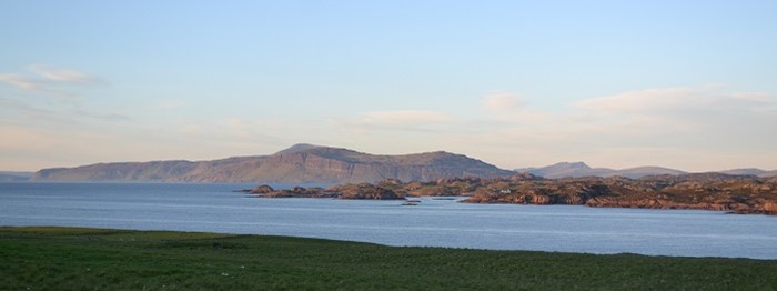 A view of water with hills in the background